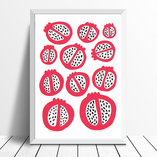 Scandinavian style kitchen wall art print of simple pomegranates. This bold red pattern of fruit creates contrast with the organic pomegranate seed shapes.