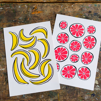 Graphic illustrated yellow and black pop art inspired banana print. A striking and retro inspired fruit print to brighten up your home.