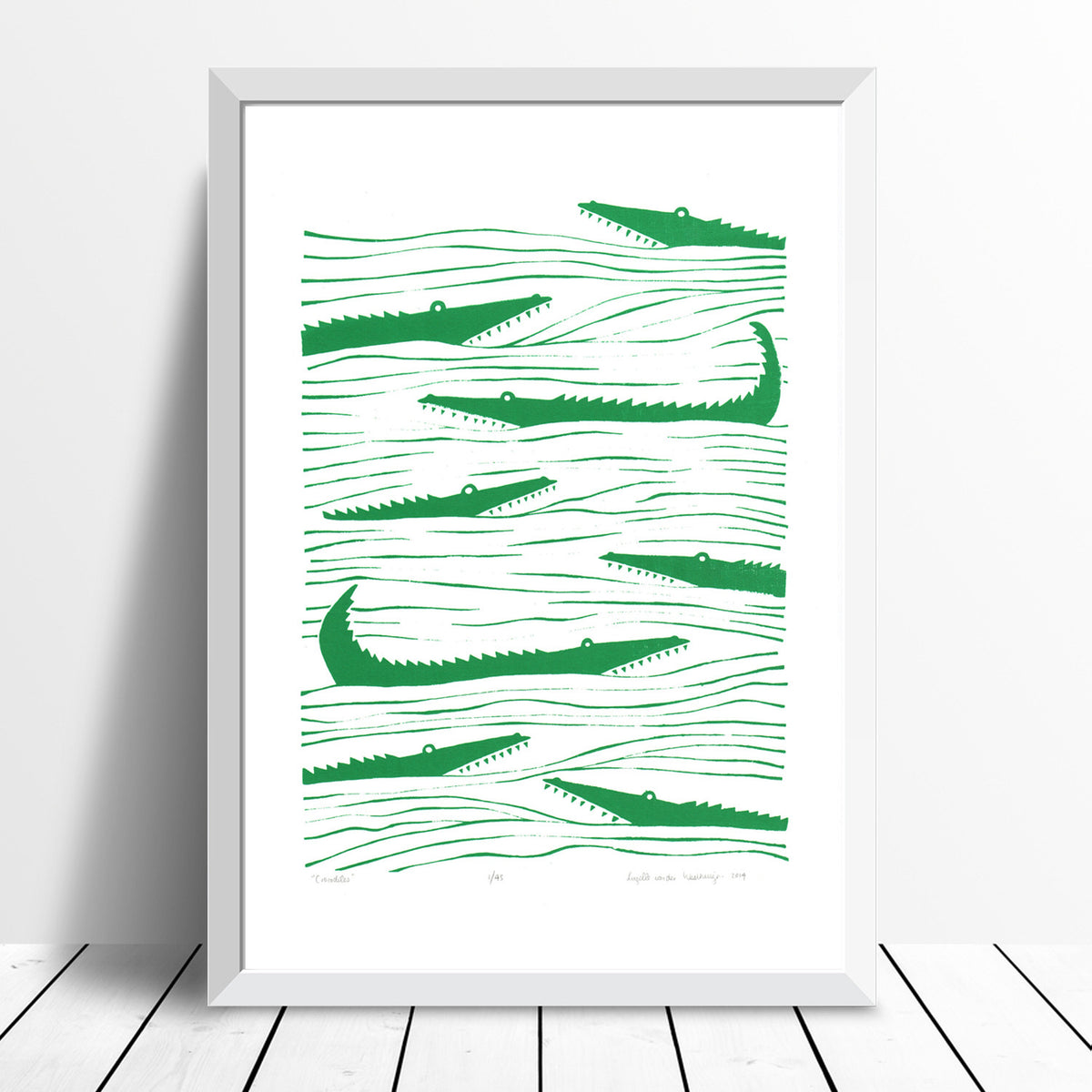 Graphic emerald green patterned art print of crocodiles lurking in the waters. Inspired by the simple shapes of animals found in African wood carvings.