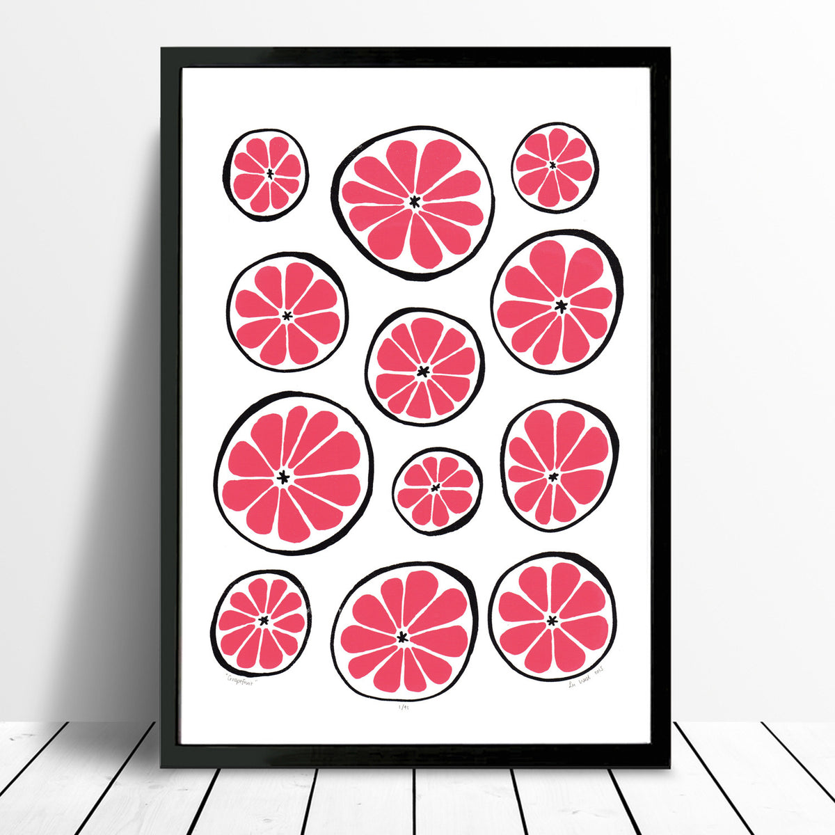 Bright and vibrant print of zesty grapefruits in bold ruby red. This playfully patterned citrus fruit print with a midcentury edge will brighten up your kitchen.