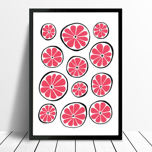 Bright and vibrant print of zesty grapefruits in bold ruby red. This playfully patterned citrus fruit print with a midcentury edge will brighten up your kitchen.